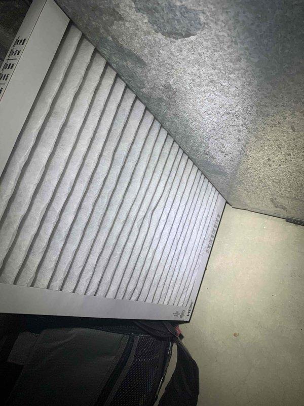 Completed comprehensive cooling system tune-up on basement-located AC unit, including filter inspection and replacement, ductwork examination, and system performance verification. Observed significant condensation on metallic ductwork indicating proper cooling operation; all components found to be functioning within normal parameters. System tested and confirmed operational for continued reliable service.