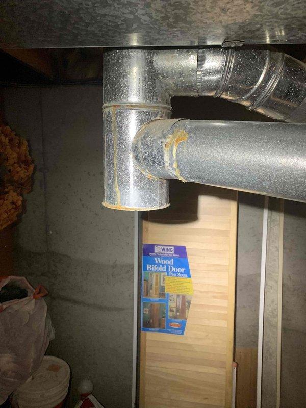 Completed comprehensive cooling system tune-up on basement-located AC unit, including filter inspection and replacement, ductwork examination, and system performance verification. Observed significant condensation on metallic ductwork indicating proper cooling operation; all components found to be functioning within normal parameters. System tested and confirmed operational for continued reliable service.