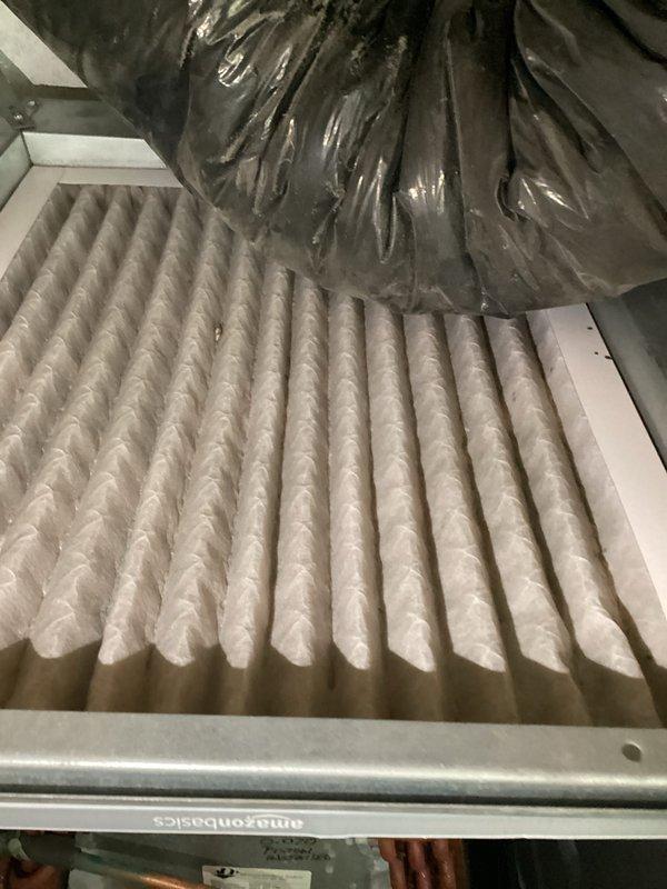 Completed comprehensive cooling system tune-up on 10-year-old outdoor unit located in backyard. Performed standard maintenance protocol including inspection of condenser coil, refrigerant lines, electrical connections, and compressor operation. Inspected indoor air handler and verified air filter condition, noting pleated filter showed normal dust accumulation but remained serviceable. Examined internal ductwork connections and confirmed all components properly secured with no hanging or disconnected ventilation observed. Unit operating within normal parameters with no immediate concerns identified.
