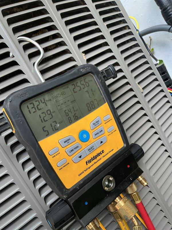 Completed comprehensive cooling system tune-up on 2-year-old residential air conditioning unit. Performed full system diagnostics including refrigerant pressure testing, temperature differential measurements, and operational assessment of outdoor condenser unit mounted on exterior wall. All components operating within manufacturer specifications; system showing proper superheat and subcooling values with adequate airflow through evaporator coil.