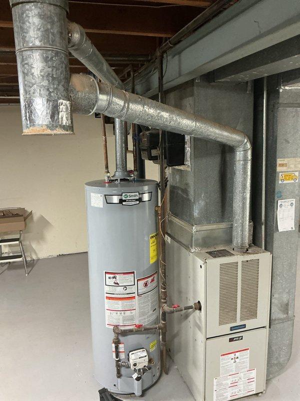 Responded to no cooling complaint on 15-year-old York residential AC system with reported rattling noise from indoor unit. Upon arrival, confirmed system was running but not producing cold air. Performed diagnostic evaluation of split system in basement mechanical room. Inspected furnace/air handler unit and associated ductwork for mechanical issues. Located source of rattling sound coming from blower assembly. Checked refrigerant pressures and found system low on charge, indicating potential leak. Inspected evaporator coil access panel and blower compartment for debris or mechanical failure. Due to age of equipment (15 years) and extent of repairs needed, discussed replacement options versus repair costs with homeowner. Recommended system replacement given combination of refrigerant loss, mechanical noise, and overall unit age approaching end of expected service life. Customer approved proceeding with full system evaluation for replacement quote.