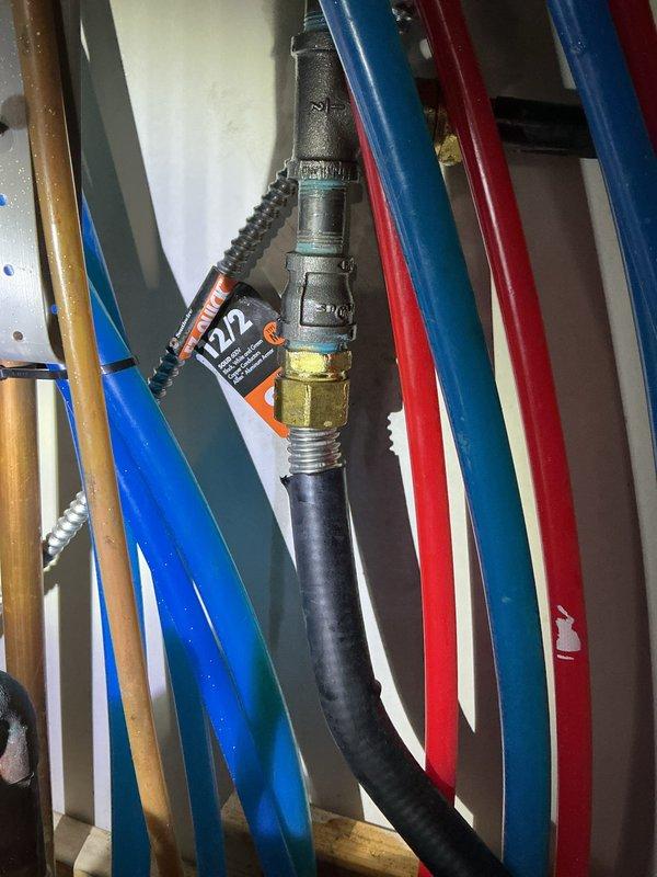 Responded to no cooling complaint on 2-month-old system. Found condensate reservoir full with non-operational condensate pump preventing proper drainage. Diagnosed pump failure causing water backup and safety shutdown of cooling system. Addressed drainage issue to restore normal system operation. Unit located in basement with outdoor condenser. System covered under first-year warranty.