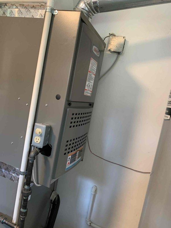 Responded to customer complaint of rumbling noise and water puddle at furnace. Upon arrival, conducted diagnostic inspection of 2-year-old HVAC system. Observed heavily soiled outdoor condensing unit with significant dirt and debris accumulation on intake panel and surrounding area, which was contributing to reduced airflow and system strain. Identified condensate drain issue causing water pooling at indoor furnace unit. Recommended thorough cleaning of outdoor condenser coils and intake filters, condensate line clearing, and system evaluation to resolve noise and drainage concerns.