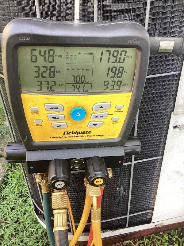 Completed comprehensive cooling system tune-up on outdoor AC unit located on side of home. Performed system diagnostics using digital manifold gauge, measuring refrigerant pressures at 648 psig and 1798 psig, verified superheat and subcooling levels within manufacturer specifications, and confirmed supply air temperature at register reading 52.8°F, indicating proper system operation and cooling performance.