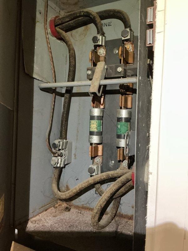 Completed comprehensive whole-home electrical inspection as part of recurring maintenance service. Inspected exposed basement ceiling electrical infrastructure, including multiple circuit wiring runs, junction boxes, and connections to verify proper installation and code compliance. Examined older electrical disconnect panel with cartridge fuses, noting age-related deterioration of cable insulation and accumulated dust within enclosure, documented all findings with photographic evidence for maintenance records.