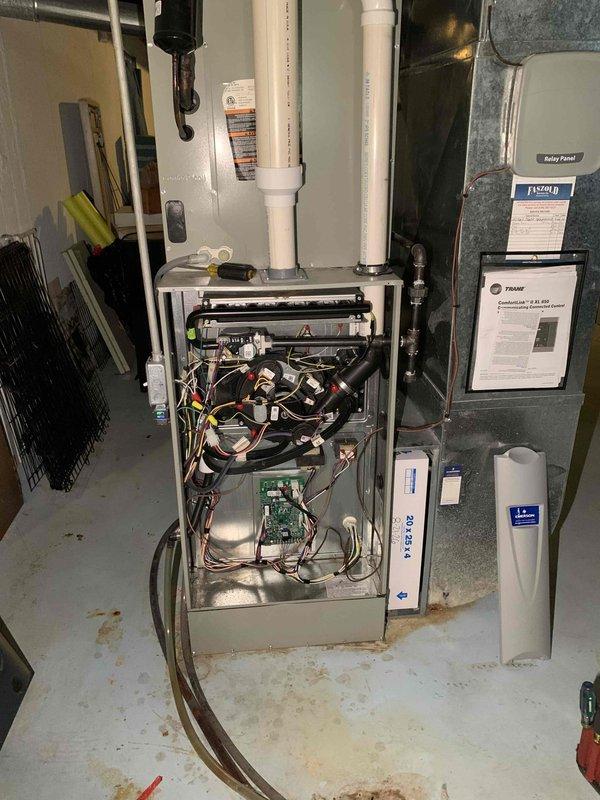 Responded to no cooling call following power surge. System displayed error codes 184.07 and 184.08 indicating control board communication fault. Inspected furnace control board and wiring harnesses for surge damage, checked all electrical connections and safety circuits. Evaporator coil found heavily contaminated with dirt and debris buildup restricting airflow. Reset control board, cleared fault codes, and restored system operation. Recommended professional coil cleaning to improve heat transfer efficiency and prevent future operational issues.