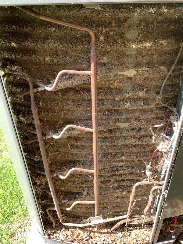 Responded to no cooling call following power surge. System displayed error codes 184.07 and 184.08 indicating control board communication fault. Inspected furnace control board and wiring harnesses for surge damage, checked all electrical connections and safety circuits. Evaporator coil found heavily contaminated with dirt and debris buildup restricting airflow. Reset control board, cleared fault codes, and restored system operation. Recommended professional coil cleaning to improve heat transfer efficiency and prevent future operational issues.