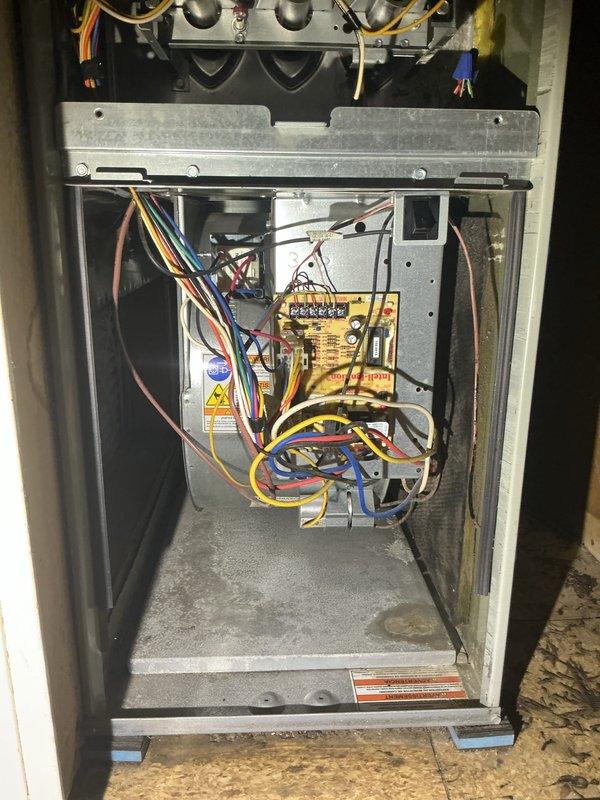 Completed cooling maintenance on single rooftop HVAC unit. Performed comprehensive system inspection including electrical testing with multimeter showing 50.0V reading, verified gas burner assemblies and ignition components, inspected control board connections and wiring integrity. All components operating within normal parameters; system ready for cooling season.