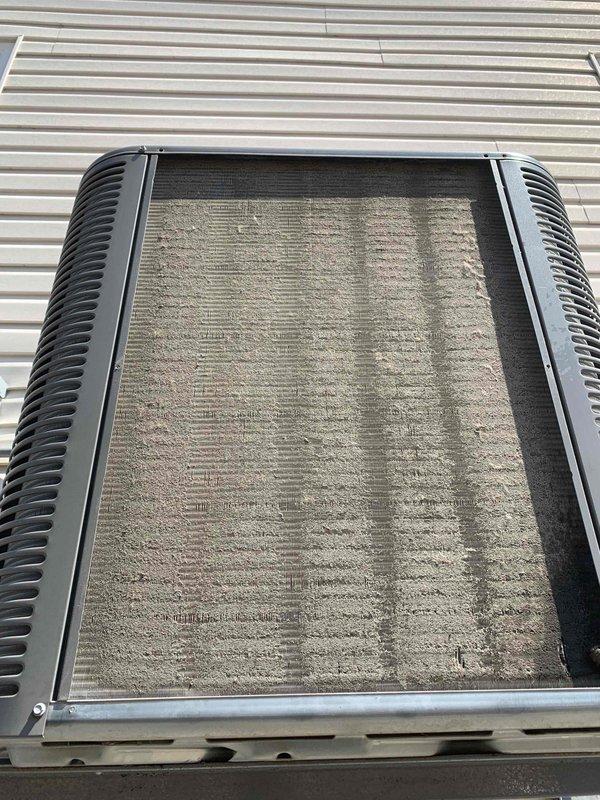 Completed standard cooling system tune-up on single AC unit. Inspected and cleaned heavily soiled air filter showing significant dust and debris accumulation across entire surface. Performed comprehensive system evaluation including airflow assessment, refrigerant level check, electrical connections inspection, and condenser coil examination. Unit operational upon completion with improved airflow efficiency following filter maintenance.