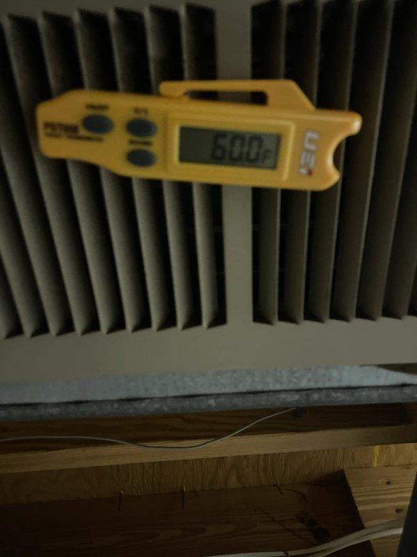 Responded to cooling failure on 15-year-old residential air conditioning system with reported 10-degree temperature differential between setpoint and actual indoor temperature. Upon arrival, performed diagnostic evaluation of outdoor condensing unit and indoor evaporator coil. Measured supply air temperature at evaporator coil, recording 50°F discharge temperature. Inspected outdoor unit electrical components including dual run capacitors and contactor assembly. Found unit operational but with reduced cooling capacity due to accumulated debris and contamination within condensing unit cabinet affecting airflow and heat transfer efficiency. Cleaned condenser coil fins, removed spider webs and debris from electrical compartment, and verified proper capacitor values and contactor operation. System restored to normal operating parameters with improved temperature differential.