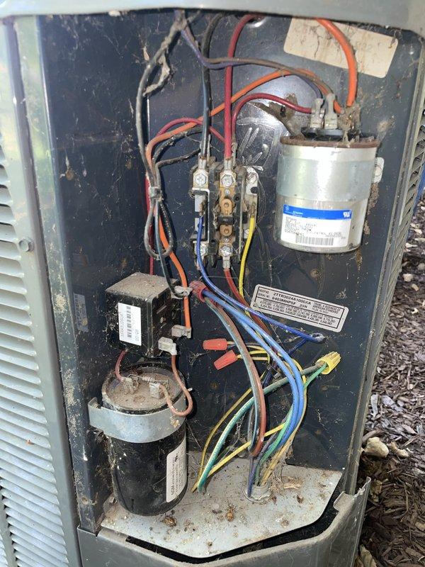 Responded to no cooling call on 10+ year old outdoor HVAC unit located in side yard. Upon arrival, inspected outdoor unit electrical compartment and found failed dual run capacitor preventing compressor and condenser fan operation. Thermostat inside home was functioning properly and set to cooling mode at 78 degrees. Replaced defective capacitor with new unit, tested all electrical connections at contactor relay, and verified proper amperage draw on compressor and fan motor. System restored to full cooling operation with normal temperature differential across evaporator coil.