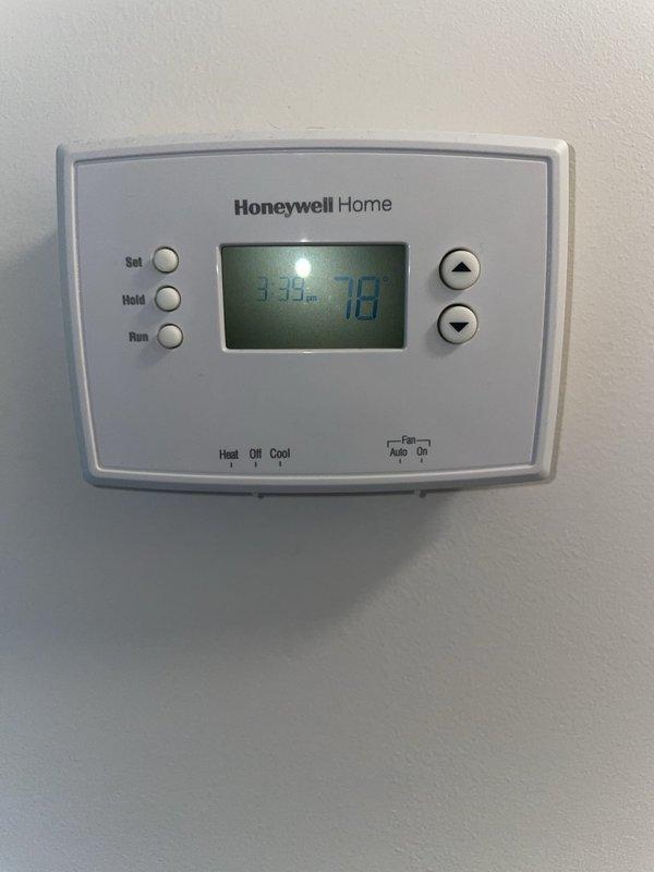 Responded to no cooling call on 10+ year old outdoor HVAC unit located in side yard. Upon arrival, inspected outdoor unit electrical compartment and found failed dual run capacitor preventing compressor and condenser fan operation. Thermostat inside home was functioning properly and set to cooling mode at 78 degrees. Replaced defective capacitor with new unit, tested all electrical connections at contactor relay, and verified proper amperage draw on compressor and fan motor. System restored to full cooling operation with normal temperature differential across evaporator coil.