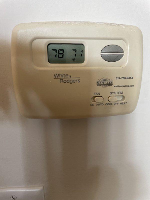 Responded to no cooling call affecting entire home with mixed system consisting of 2020 Trane evaporator coil and 2017 Lennox condensing units. Upon arrival, found thermostat set to 71°F with display showing 78°F ambient temperature, indicating system was not maintaining setpoint. Inspected outdoor unit electrical panel and verified TITAN HD dual run capacitor (PRCFD7010A) condition, checked all wire connections and control circuit integrity. Documented thermostat operation and condensing unit electrical components with photos. Updated customer contact information with alternative phone number per request.