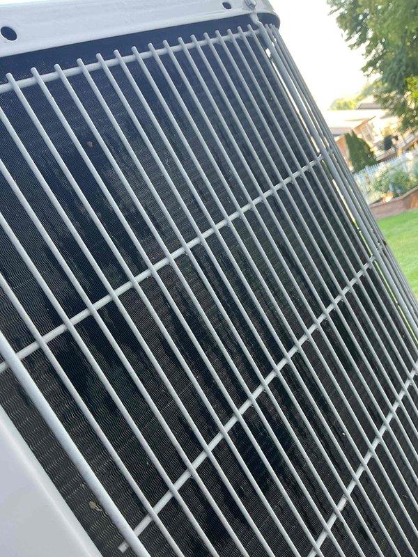 Completed comprehensive cooling maintenance tune-up on a 9-year-old residential air conditioning system. Performed full system inspection including condenser unit examination, verified proper operation of all electrical connections and controls, and confirmed heat exchanger coils and protective grille were clean and in good condition. System tested and operating within normal parameters with no deficiencies noted.