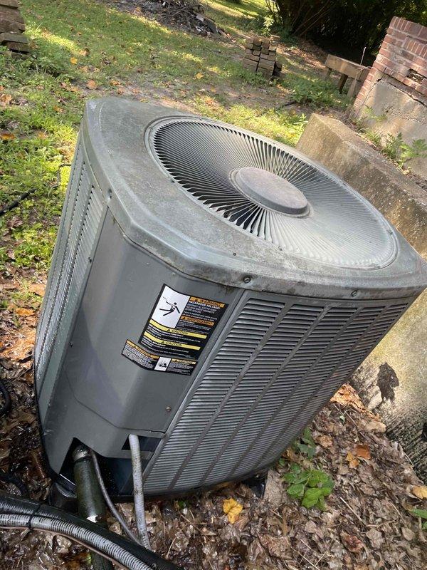 Completed comprehensive tune-up service on two residential air conditioning systems. Upon arrival, found outdoor condensing unit with significant dirt accumulation and debris around equipment perimeter. Performed thorough inspection of both units, including visual assessment of condenser coils which revealed heavy buildup of dust, lint, and particulate matter restricting airflow through fin structure. Cleaned condenser coils to restore proper heat transfer efficiency and checked all electrical connections. Verified refrigerant lines, tested system operation, and cleared surrounding area of leaves and organic debris to ensure adequate ventilation clearance around equipment.