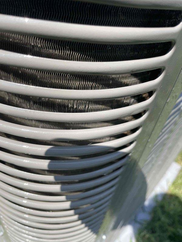 Completed comprehensive cooling system tune-up on 2-year-old Lennox air conditioning unit. Performed full preventive maintenance inspection including condenser coil cleaning, electrical connections check, refrigerant level verification, and system performance testing. Unit operational and running efficiently with no issues identified; condenser coils found in clean condition and all components functioning within manufacturer specifications.