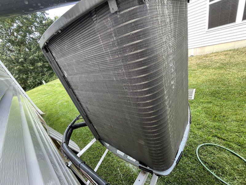 Completed cooling system tune-up on 1-year-old residential AC unit. Performed comprehensive inspection of condenser unit, noting moderate dirt and debris accumulation on heat exchanger coils. Accessed interior components, verified filter condition, checked refrigerant lines, and ensured all mechanical and electrical systems operating within manufacturer specifications.