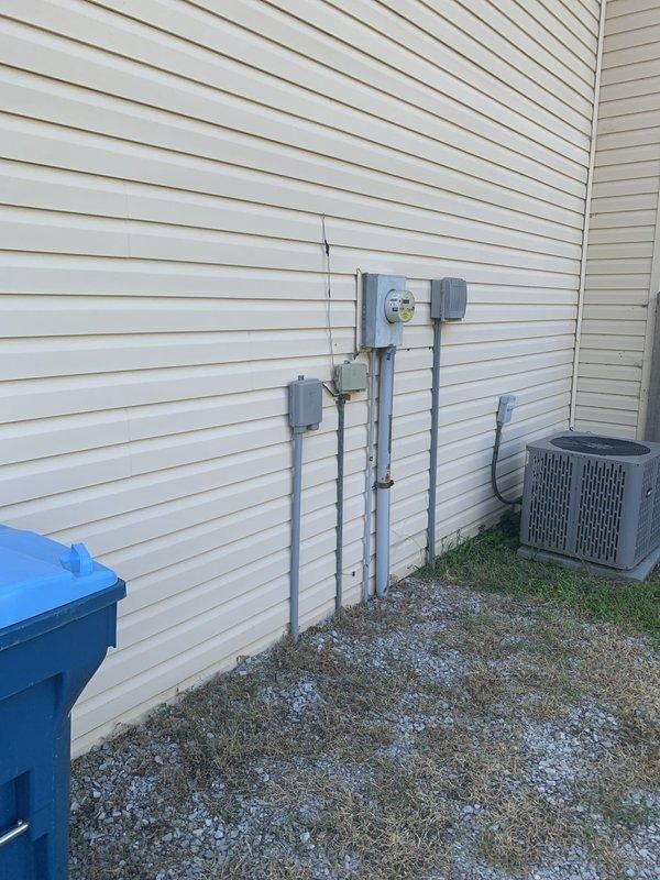 Completed electrical panel replacement on residential property. Installed new main service panel with updated circuit breakers, relocated meter base, and ran new conduit along exterior wall to code specifications. All electrical connections tested and verified operational upon completion.