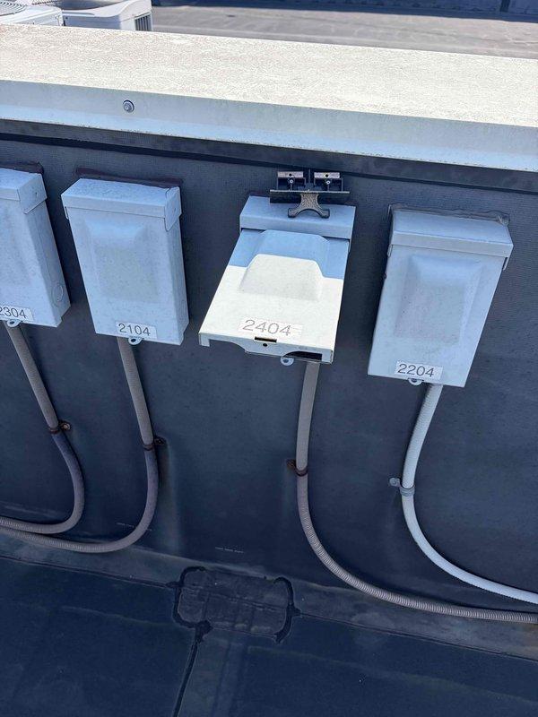 Completed preventive maintenance tune-up on rooftop air conditioning unit. Performed comprehensive system inspection, checked refrigerant levels, tested electrical connections, and verified proper operation of all components. Inspected air filter showing moderate dust accumulation and documented current condition of unit and electrical meter setup for multi-unit building.