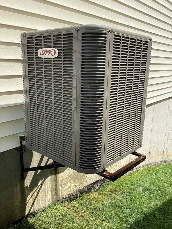 Completed follow-up repair service on HVAC system. Replaced defective flue pipe with proper elbow fitting in attic space to ensure correct venting configuration. Performed thorough cleaning of exterior Lennox condenser unit by hosing down coils and exterior surfaces to remove debris and improve system efficiency. Documented all completed work with photographs of the installed flue pipe assembly and cleaned condenser unit for service records.