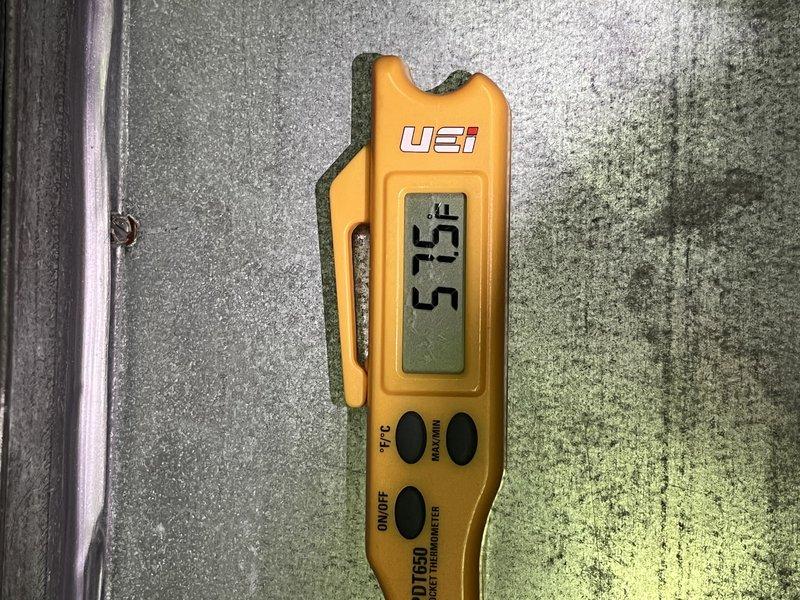 Completed comprehensive Supertune maintenance on 20-year-old AC and furnace system located in basement. Performed full system diagnostics with temperature readings showing 57.5°F at evaporator coil and 74°F ambient temperature, confirming proper cooling differential. All system components inspected, cleaned, and tested to manufacturer specifications to ensure optimal performance and equipment longevity.