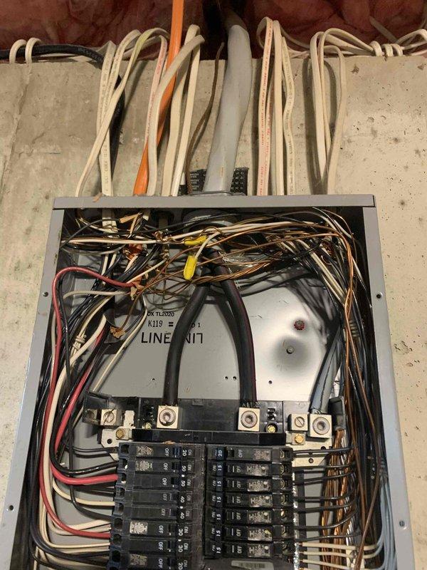 Performed comprehensive electrical troubleshooting and thermal imaging inspection of main electrical panel. Infrared scanning revealed elevated temperatures at multiple connection points, with hotspots measuring up to 88.7°F at upper bus bar terminals and 74.9°F at lower circuit breaker connections, indicating potential loose connections or excessive electrical resistance. Inspected panel interior components including dual-row circuit breaker arrangement, main bus bar terminals, and all wire terminations. Documented existing conditions showing multiple wire colors entering panel through various conduits including gray PVC and orange conduit. Provided detailed thermal imaging analysis and photographic documentation of panel conditions for estimate preparation and future corrective action recommendations.