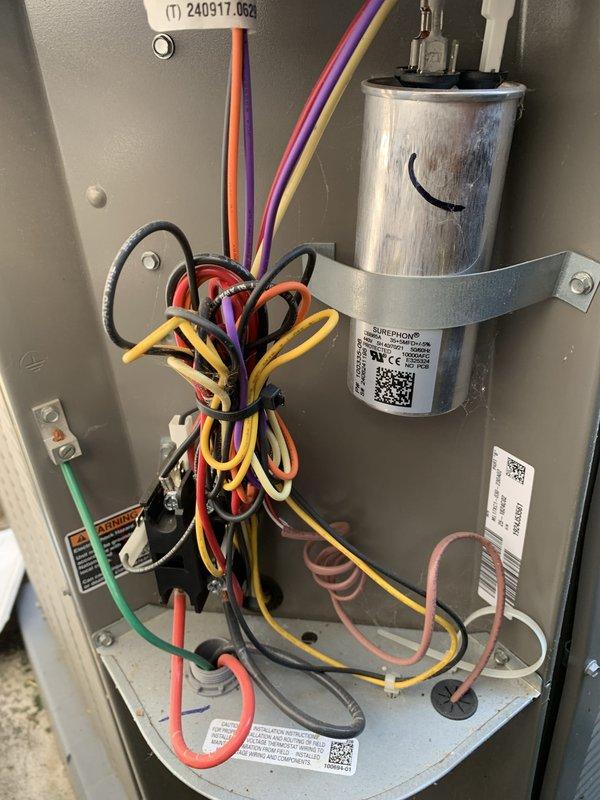 Performed comprehensive cooling system tune-up on 2024 model AC unit located in backyard/side yard area. Conducted electrical diagnostics using clamp meter to verify proper amperage draw and system performance, inspected control panel wiring and capacitor for proper connections and specifications, and documented all components functioning within normal parameters. Customer requested heating system tune-up be scheduled for future service.