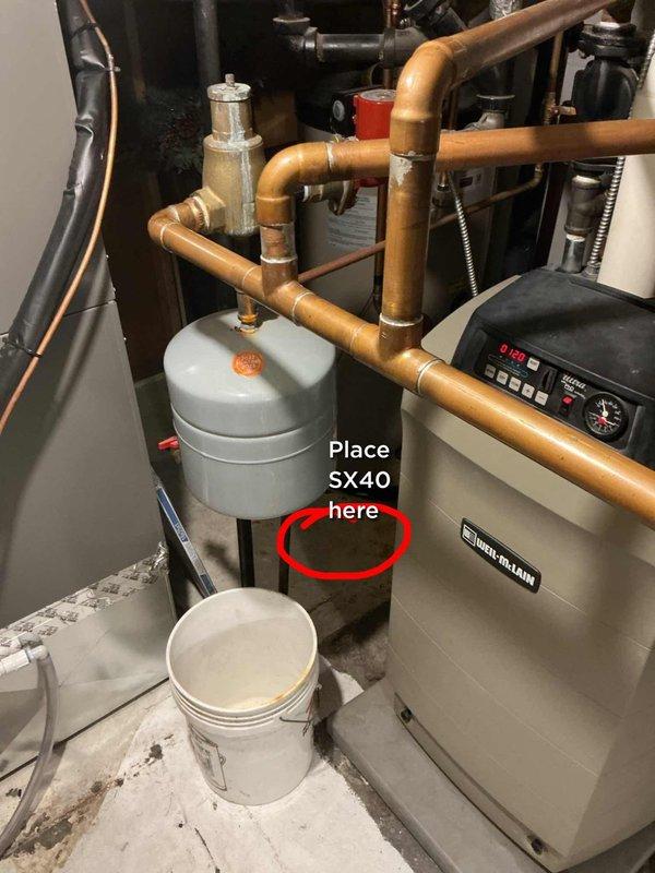 Responded to service call for boiler system tripping when hot water was called for. Upon inspection of the 10+ year old basement unit, diagnosed faulty circulator causing system lockout requiring manual reset. Recommended and documented placement location for SX40 expansion tank installation to address thermal expansion issues contributing to system instability. System tested and operational upon departure.