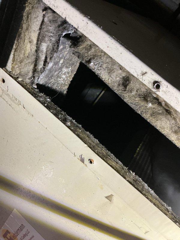 Responded to no cooling call on residential HVAC system over 10 years old. Upon arrival, contacted customer and instructed to power down unit prior to 30-minute call-ahead. Found air handler blowing warm air only with no cooling capacity. Inspection revealed significant dust and debris accumulation throughout the air handler plenum and internal components, indicating extended period without maintenance. Documented system condition including heavily contaminated ductwork, degraded airflow paths, and overall equipment age and wear. System requires cleaning, potential component replacement, and further diagnostic evaluation to restore proper cooling function.