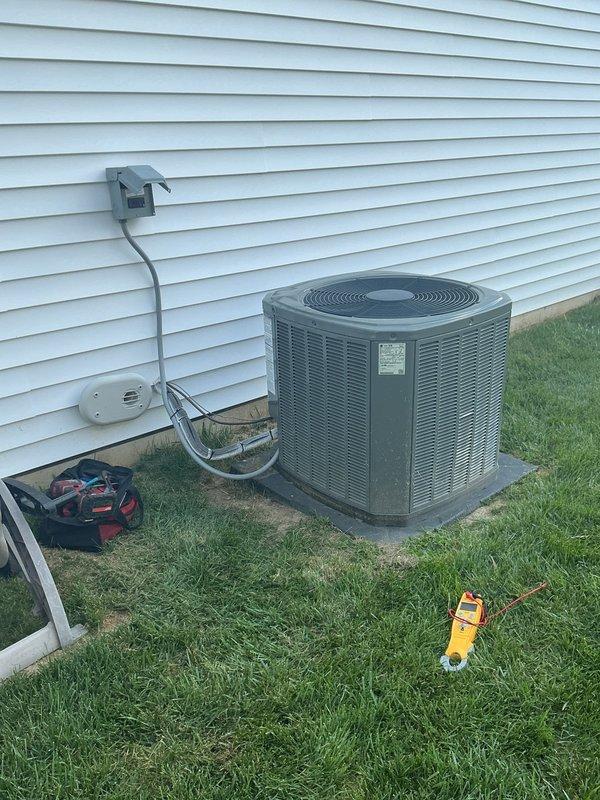Performed comprehensive second-opinion diagnostic on 2-year-old residential air conditioning system. Conducted thorough inspection of outdoor condensing unit including visual examination of condenser coils, electrical connections, capacitor, and compressor motor assembly. Utilized digital multimeter to test electrical components and verify proper voltage and capacitance readings. Inspected wire connections with twist-on connectors for secure termination and proper polarity. Evaluated condenser coil condition, finding fins clean and free of debris or damage. Assessed compressor motor mounting and electrical connections for integrity. Verified disconnect box and electrical service connections at exterior wall. Provided detailed findings and discussed maintenance membership options with homeowner, noting family member's existing relationship with company.