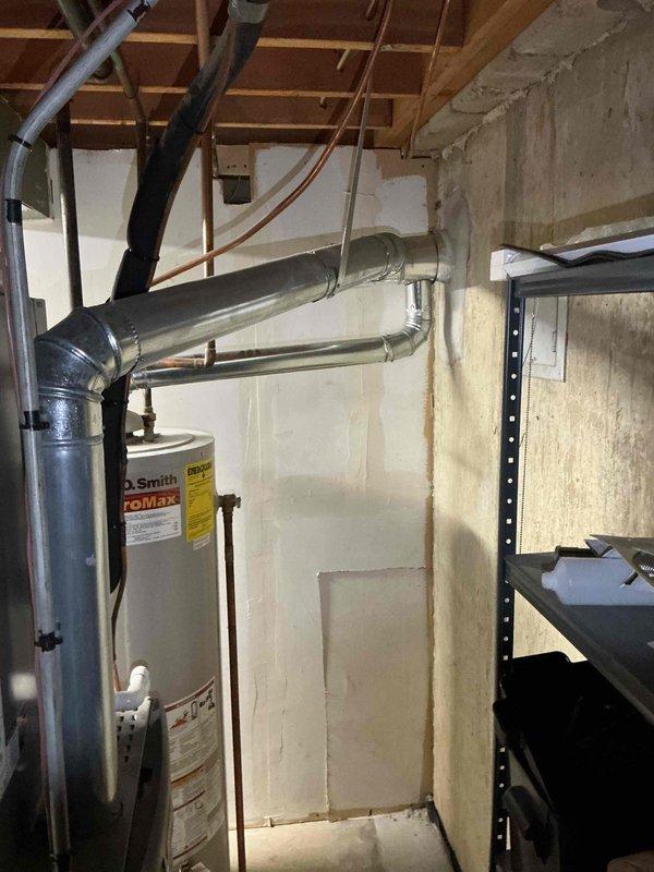 Successfully installed a 50-gallon tall gas water heater (A.O. Smith ProMax model) in basement location. Installation included proper venting configuration with metallic ductwork, connection of hot and cold water supply lines using copper and appropriate piping materials, and installation of safety shutoff valves with green handles. All plumbing connections were completed to code specifications, gas line properly connected, and temperature/pressure relief valve installed. Work performed under plumbing permit 26PLU-17333 with licensed plumber supervision. Unit tested for proper operation, all connections inspected for leaks, and installation verified to meet manufacturer specifications and local building codes.