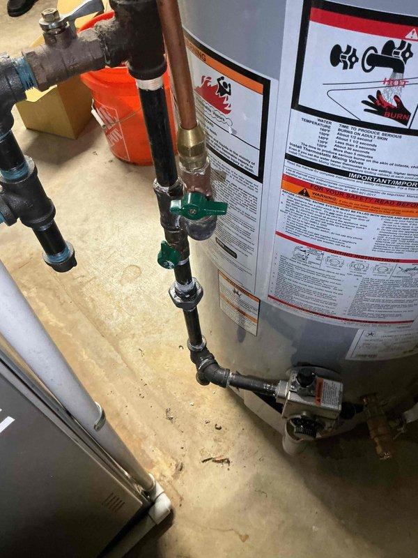 Successfully installed a 50-gallon tall gas water heater (A.O. Smith ProMax model) in basement location. Installation included proper venting configuration with metallic ductwork, connection of hot and cold water supply lines using copper and appropriate piping materials, and installation of safety shutoff valves with green handles. All plumbing connections were completed to code specifications, gas line properly connected, and temperature/pressure relief valve installed. Work performed under plumbing permit 26PLU-17333 with licensed plumber supervision. Unit tested for proper operation, all connections inspected for leaks, and installation verified to meet manufacturer specifications and local building codes.