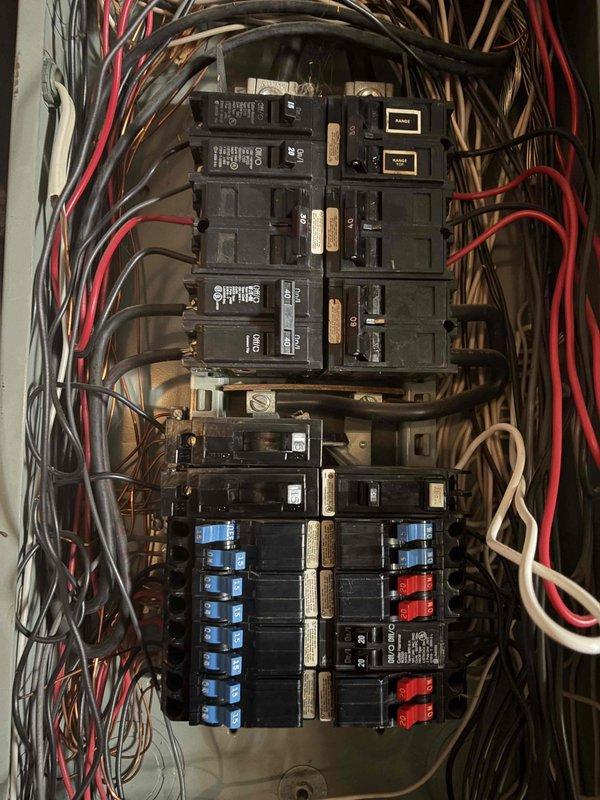 Responded to service call for multiple non-functioning interior and exterior outlets. Performed diagnostic testing at electrical panel to identify tripped breakers and circuit issues affecting the outlet circuits. Inspected panel configuration, verified proper breaker operation, and documented existing electrical system conditions. Reset affected circuits and confirmed restoration of power to previously inoperative outlets throughout the property.