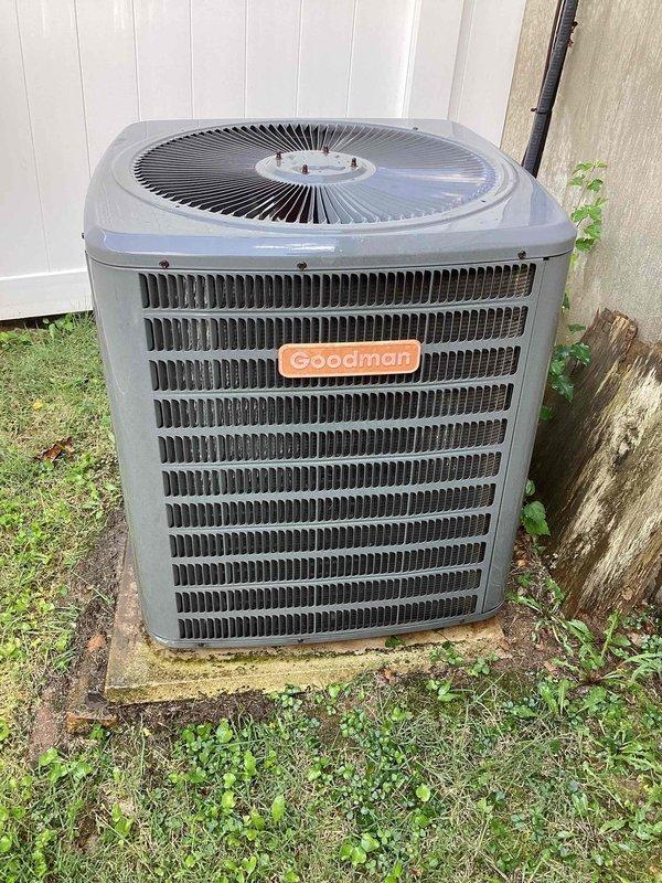 # HVAC Cooling System Tune-Up Completed

Performed comprehensive preventative maintenance tune-up on a 16-year-old Goodman outdoor condensing unit. Conducted full system inspection including visual assessment of condenser cabinet, coil condition, and fan operation. Verified proper refrigerant levels, checked electrical connections and capacitor performance, cleaned condenser coils, and ensured adequate airflow through unit. Inspected analog Lennox thermostat for proper operation and temperature calibration. Unit found to be in operational condition with normal wear consistent with age. System tested and verified cooling cycle functionality upon completion of service.