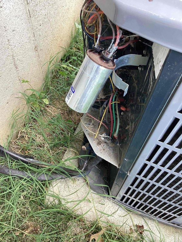 Responded to no cooling complaint on 10+ year old air conditioning system. Upon inspection, found outdoor condensing unit with compromised capacitor and degraded wiring connections. Advised immediate system shutdown to prevent compressor damage while leaving air handler fan operational for air circulation. Documented equipment condition including visible wear, accumulated debris, and electrical component deterioration requiring replacement before system can be safely returned to service.