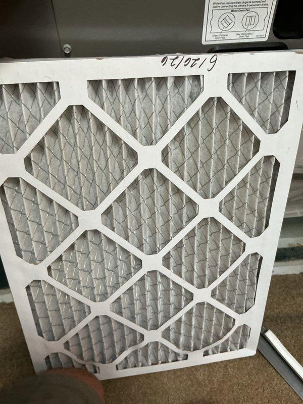 Completed comprehensive cooling tune-up maintenance on three residential air conditioning units located on the exterior side of the property. Performed standard preventive maintenance procedures on all systems including inspection of electrical components, wiring connections, control boards, and blower assemblies. Documented existing air filter condition showing installation date of May 2019, indicating overdue replacement on at least one unit's air handling system.