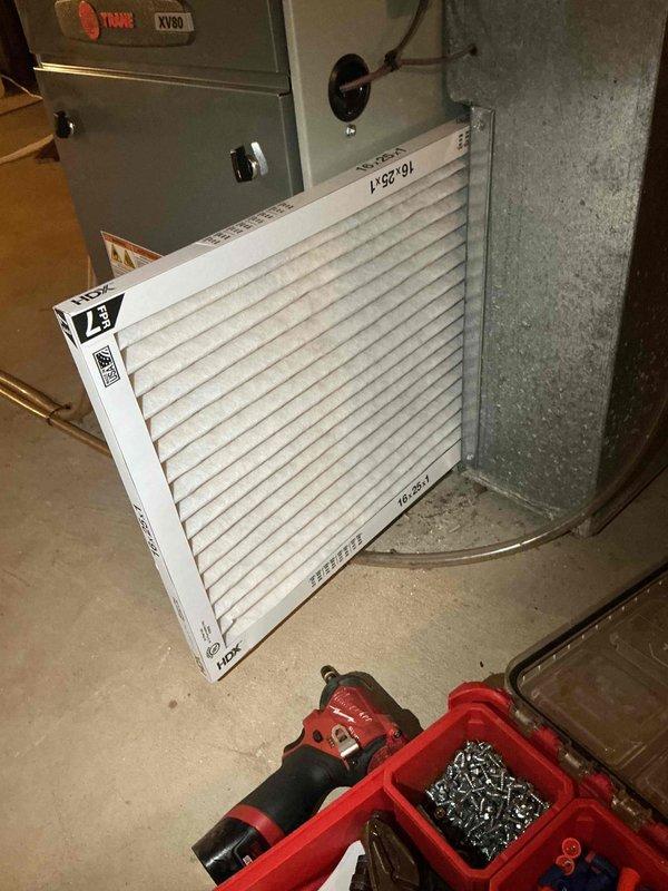 Completed cooling tune-up on 10-year-old Trane XV80 system. Replaced 18x24x1 air filter and inspected evaporator coil, which showed significant dust and debris accumulation between fins requiring attention. Performed standard maintenance procedures including system inspection, verified refrigerant lines, and assessed overall unit operation to ensure proper cooling performance for the upcoming season.
