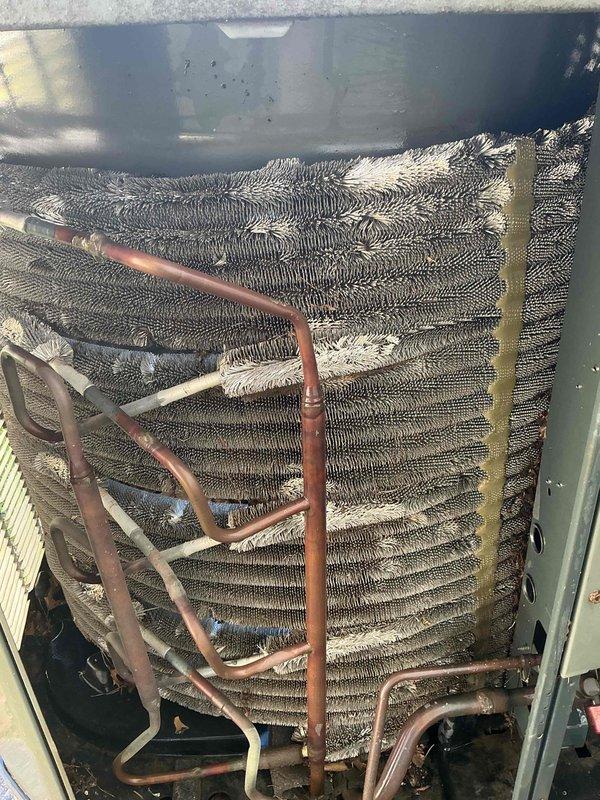 Completed cooling tune-up on 10-year-old Trane XV80 system. Replaced 18x24x1 air filter and inspected evaporator coil, which showed significant dust and debris accumulation between fins requiring attention. Performed standard maintenance procedures including system inspection, verified refrigerant lines, and assessed overall unit operation to ensure proper cooling performance for the upcoming season.