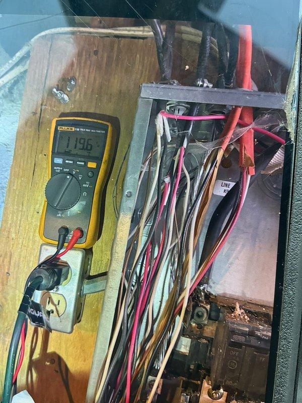Responded to maintenance callback for AC unit not blowing cold air with inoperative fan. Performed diagnostic testing on electrical panel and control board using Fluke multimeter to measure voltage and continuity. Measured line voltage at 79.1V and additional readings at 1.96V to isolate electrical fault. Inspected wiring connections including line, load, and control circuits within electrical panel. Identified and resolved electrical issue causing fan motor failure. Verified proper voltage supply to all components and confirmed system returned to normal cooling operation with fan functioning correctly.