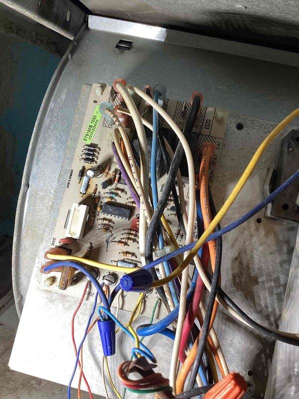Responded to service call for AC unit freezing over. Upon arrival, inspected the system and found the unit had been turned off per prior instruction. Performed diagnostic evaluation of the electrical control panel and circuit board components. Checked thermostat operation and verified system controls were functioning properly. Documented equipment condition with photos of the control panel wiring and Honeywell thermostat for service records.