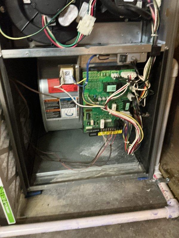 Completed comprehensive cooling system tune-up on 10-year-old air conditioning unit. Performed standard preventive maintenance procedures including inspection of control board, electrical connections, and wiring harnesses within air handler compartment. Verified proper operation of blower motor assembly and all safety controls. Inspected filtration system and ventilation components for proper airflow. All electrical terminals, relays, and transformer connections found secure with no signs of overheating or deterioration. System tested and operating within normal parameters upon completion.