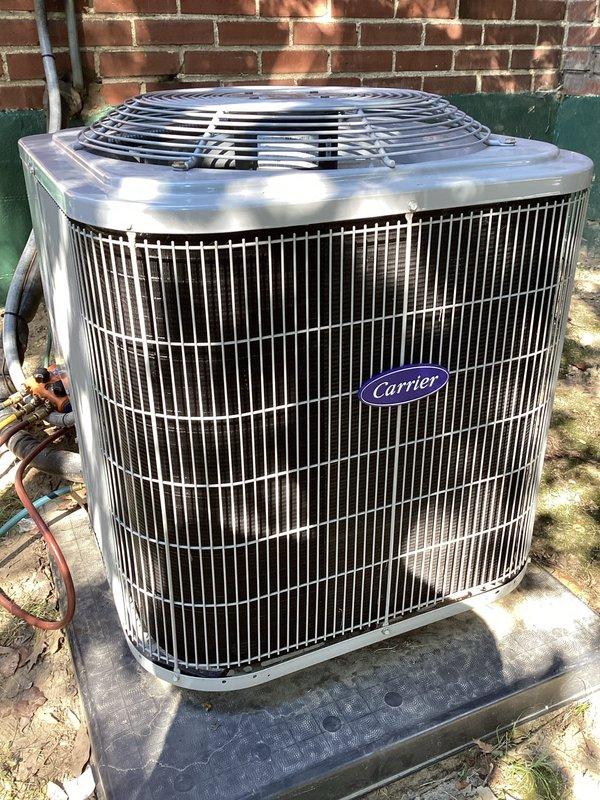 Replaced failed condenser coil on residential Carrier air conditioning system per Home Depot warranty authorization. Removed old corroded coil showing significant weathering and fin deterioration, installed new replacement coil, and restored system to proper cooling operation. Disposed of defective component and verified unit functionality upon completion.
