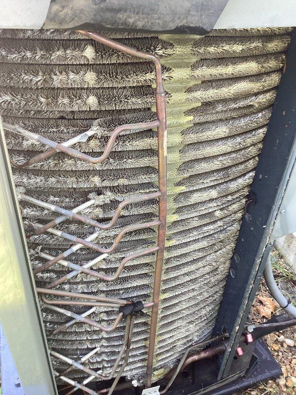 Completed comprehensive cooling system tune-up on outdoor AC unit located at side of home. Performed full system inspection, accessing control panel to evaluate electrical components, circuit boards, capacitors, and wiring connections. Cleaned heavily soiled condenser coil which showed significant dirt and debris accumulation, restoring proper airflow through fin assembly. Inspected refrigerant lines and verified all electrical connections were secure throughout the system.