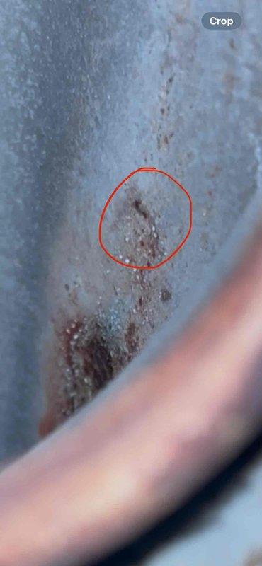 # HVAC Service Summary

Completed comprehensive tune-up and maintenance on split system furnace and air conditioning unit per customer request, with both systems operating properly at time of service. During routine inspection, discovered significant frost buildup on evaporator coil interior with visible rust penetration in multiple areas, and identified exterior corrosion breakthrough on refrigerant line seam where paint protection has failed, indicating potential refrigerant leak points requiring monitoring or future repair.

# Detailed Service Report

Performed complete preventative maintenance tune-up on residential split HVAC system including both furnace and air conditioning components. Customer reported no operational issues, and both systems were functioning properly upon arrival.

Conducted thorough visual inspection of all accessible system components. During AC unit examination, documented heavy frost accumulation on evaporator coil interior surfaces with crystalline ice bui