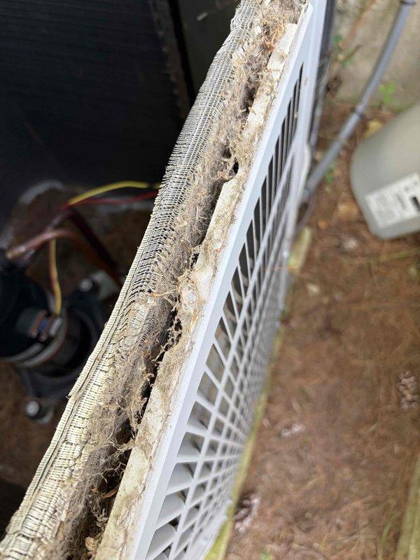 Responded to service call for second floor system experiencing breakdown and aggressive freeze-up conditions. Upon inspection, found extensive ice buildup on evaporator coil preventing proper assessment. Documented severely restricted airflow at return air vent with significant dust and debris accumulation that likely contributed to reduced system performance. Measured system parameters and photographed coil assembly showing copper line connections and finned heat exchanger. Due to extent of ice formation, system requires defrost period before comprehensive leak search can be performed to determine if evaporator coil has failed. Return visit scheduled to complete refrigerant leak detection and provide definitive diagnosis once coil is fully thawed.