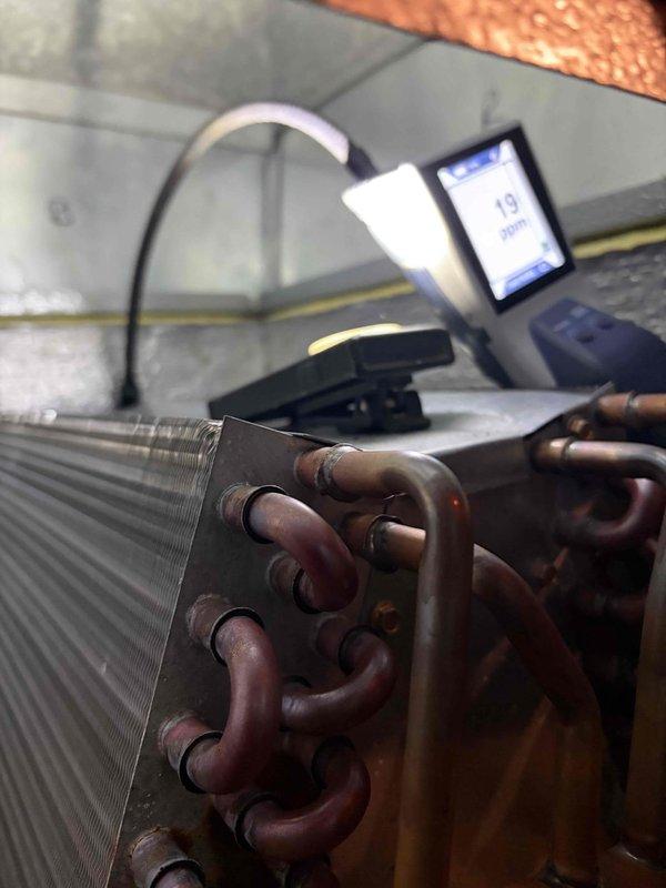 Responded to service call for second floor system experiencing breakdown and aggressive freeze-up conditions. Upon inspection, found extensive ice buildup on evaporator coil preventing proper assessment. Documented severely restricted airflow at return air vent with significant dust and debris accumulation that likely contributed to reduced system performance. Measured system parameters and photographed coil assembly showing copper line connections and finned heat exchanger. Due to extent of ice formation, system requires defrost period before comprehensive leak search can be performed to determine if evaporator coil has failed. Return visit scheduled to complete refrigerant leak detection and provide definitive diagnosis once coil is fully thawed.