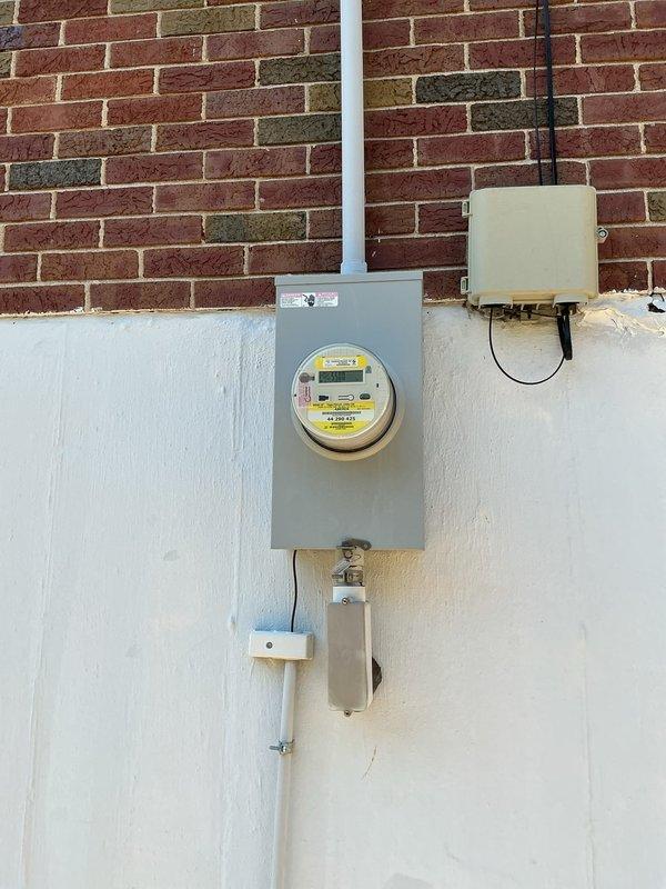 Completed comprehensive electrical inspection of residential property. Examined exterior electrical service installation including digital meter assembly, conduit routing, junction boxes, and disconnect switch mounted on exterior wall. Verified proper installation of all electrical components, weatherproofing, and code compliance. Inspected interior garage electrical panel, wiring runs, and overall electrical system condition. All components found to be functioning properly with no deficiencies noted.