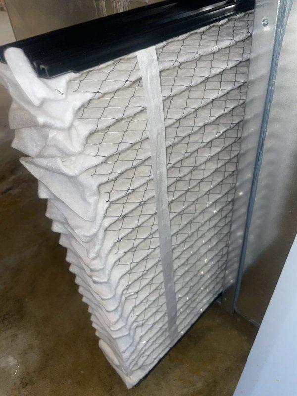 Responded to service call for brand new Lennox HVAC system experiencing heavy water leakage causing rust formation on new metal components. Upon arrival, inspected air handler unit and ductwork system in basement installation. Documented existing conditions with photographs showing pleated air filter assembly and main furnace/air handler unit with associated ductwork. Identified water leak issue affecting system integrity and causing premature corrosion on recently installed metal components. System remains under warranty coverage through July 2027. Performed diagnostic assessment and documented findings for warranty claim processing and corrective action.