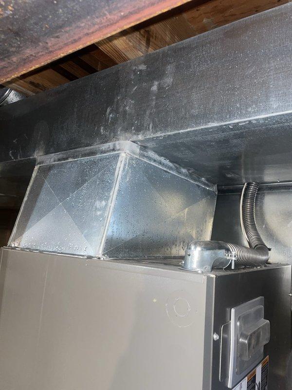 Responded to service call for brand new Lennox HVAC system experiencing heavy water leakage causing rust formation on new metal components. Upon arrival, inspected air handler unit and ductwork system in basement installation. Documented existing conditions with photographs showing pleated air filter assembly and main furnace/air handler unit with associated ductwork. Identified water leak issue affecting system integrity and causing premature corrosion on recently installed metal components. System remains under warranty coverage through July 2027. Performed diagnostic assessment and documented findings for warranty claim processing and corrective action.