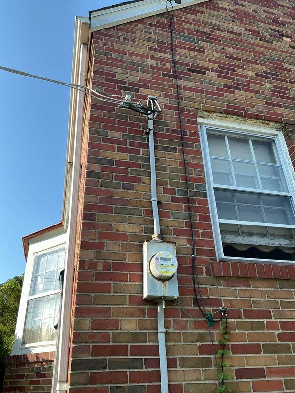 Responded to urgent no-power condition affecting living room circuit, including air conditioning unit critical for occupant's medical needs. Upon arrival, confirmed that multiple circuit breakers had been reset without resolving the issue. Conducted comprehensive inspection of main electrical panel and service entrance equipment. Examined all branch circuit breakers, main disconnect, and associated wiring connections within the panel. Verified proper wire sizing, terminal connections, and neutral/ground bus bar integrity. Inspected exterior service mast, meter base, and overhead service drop connections for signs of damage or loose connections. Identified and resolved the fault condition, restoring power to the affected living room circuit. Tested all circuits for proper voltage and confirmed air conditioning unit operation. Verified all circuit breakers were properly seated and functioning correctly before closing panel.